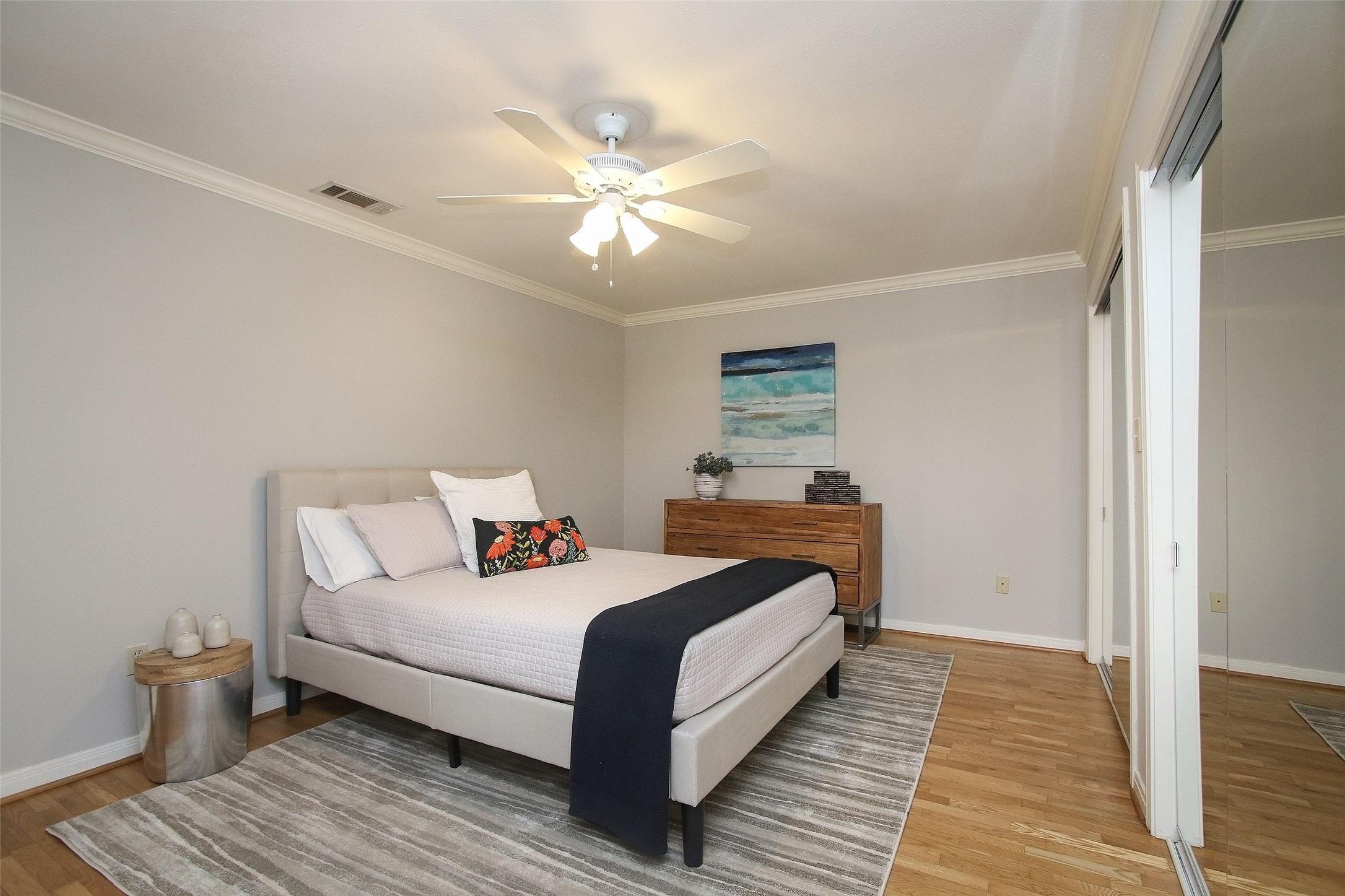 1307 Welch Street, Unit 6 Houston, TX 77006 - Photo 15 of 23 a bedroom with a bed and wooden floor