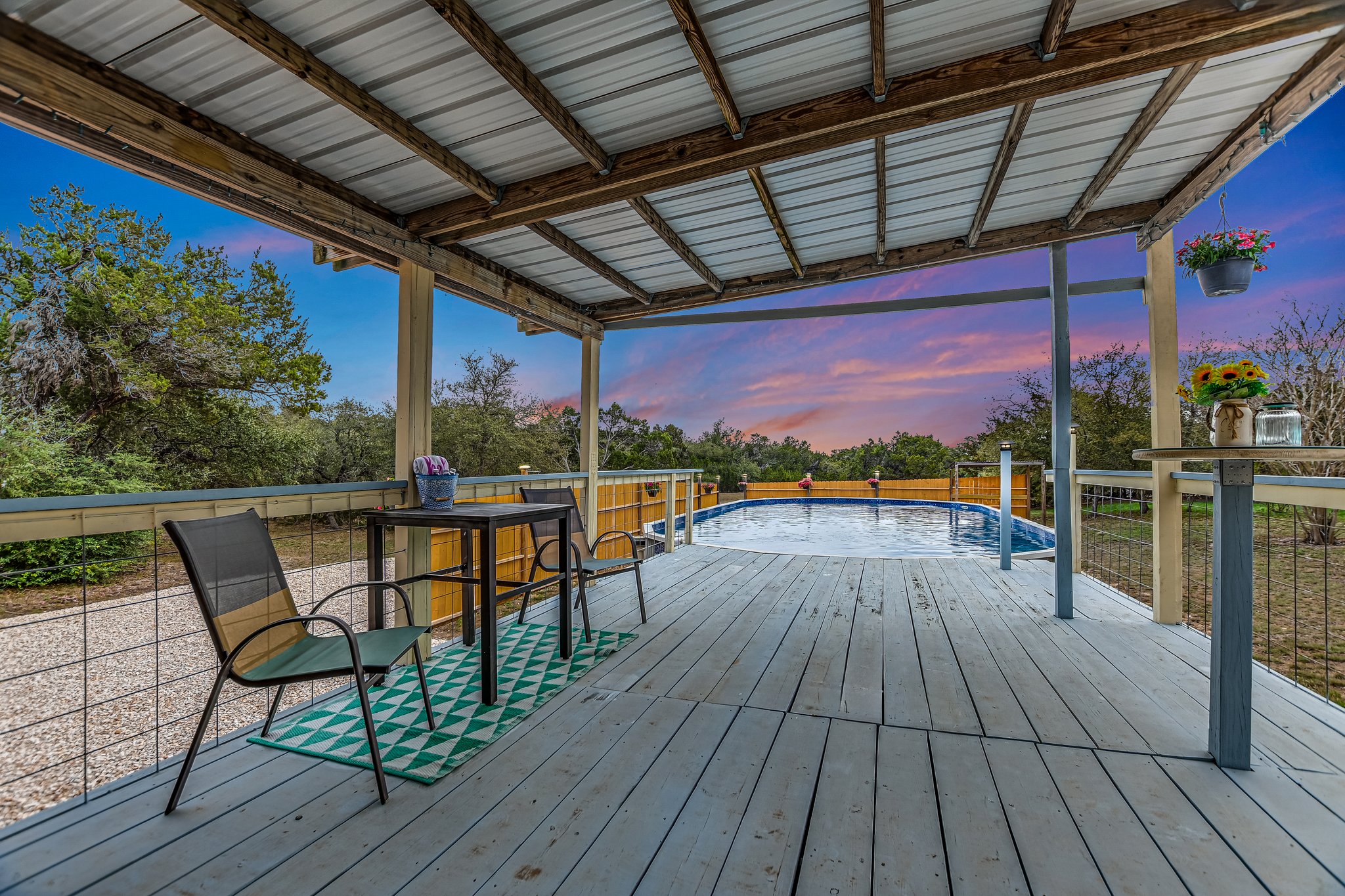 300 Round Rock Road Wimberley, TX 78676 - Photo 18 of 23 Entertain on this spacious deck and enjoy the water. Recently replaced liner and plumbing.