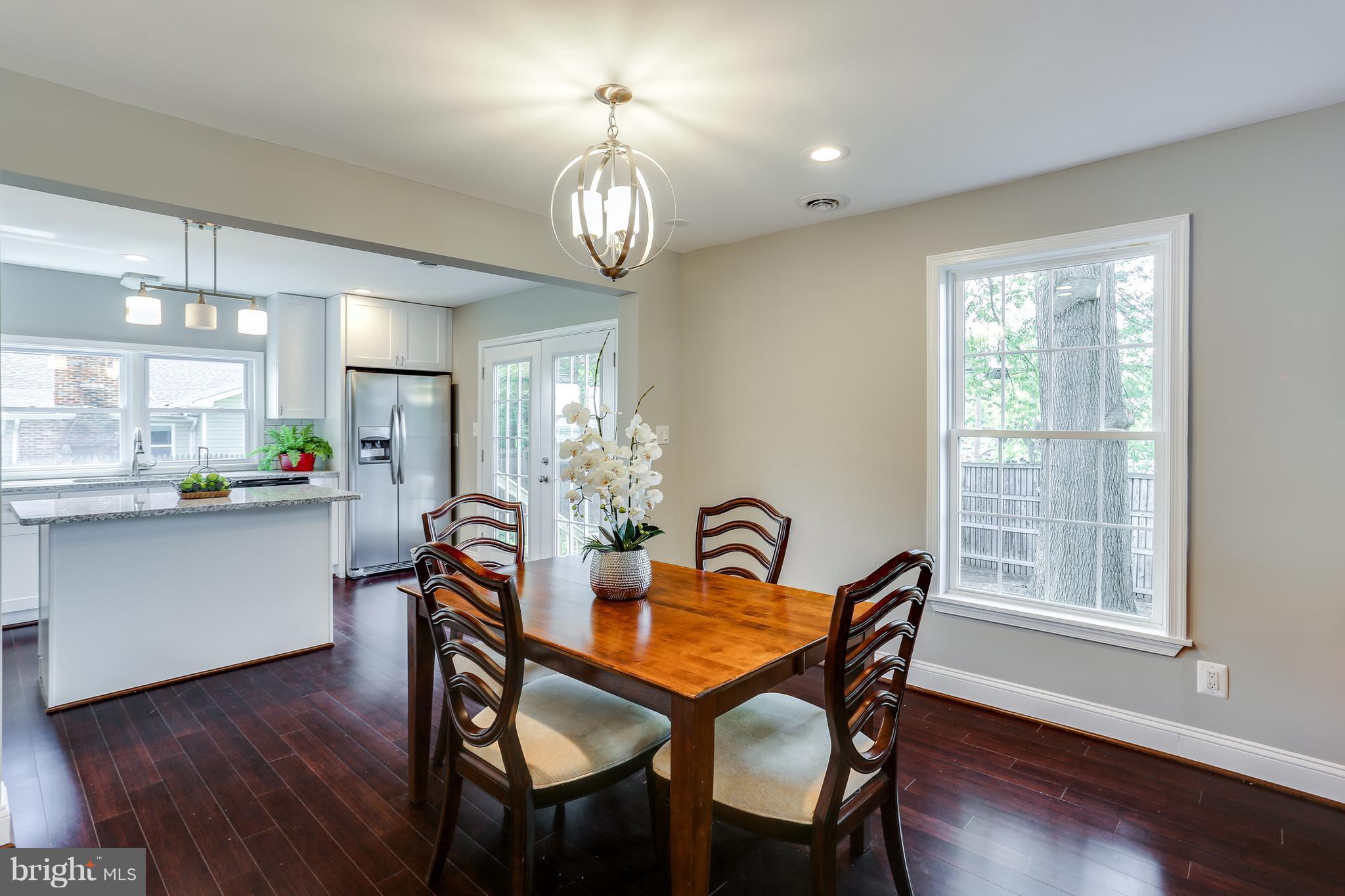 1700 Quantico Road Edgewater, MD 21037 - Photo 16 of 25 a view of a dining room with furniture window and wooden floor