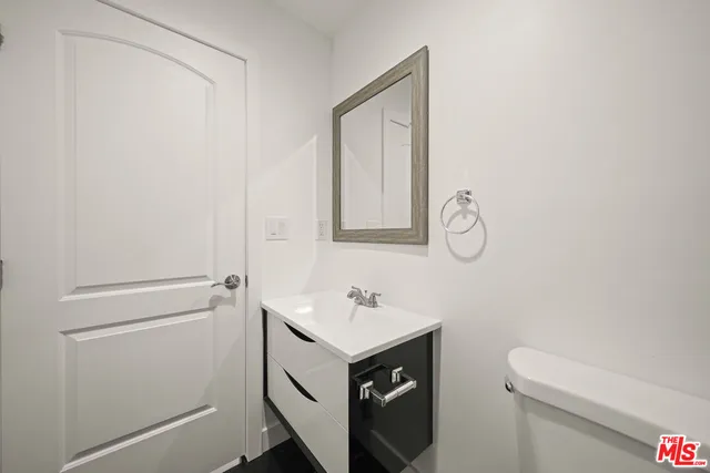 a bathroom with a sink toilet and vanity