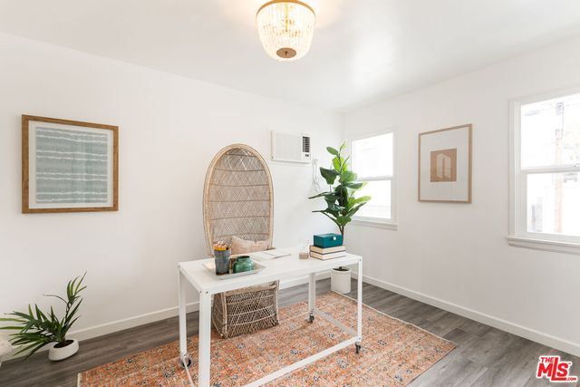 a workspace with furniture and a window