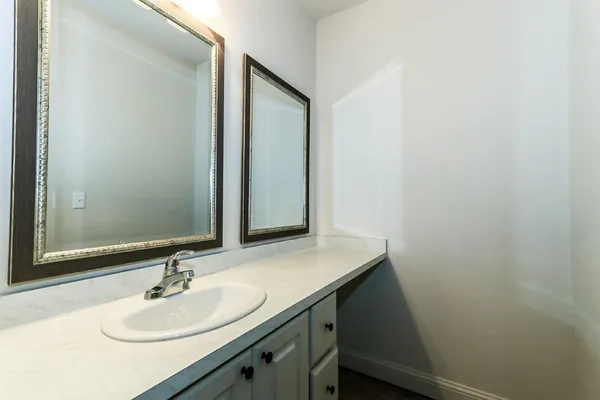 an empty room with closet and chandelier fan