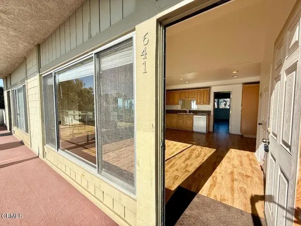 a view of a living room and front door