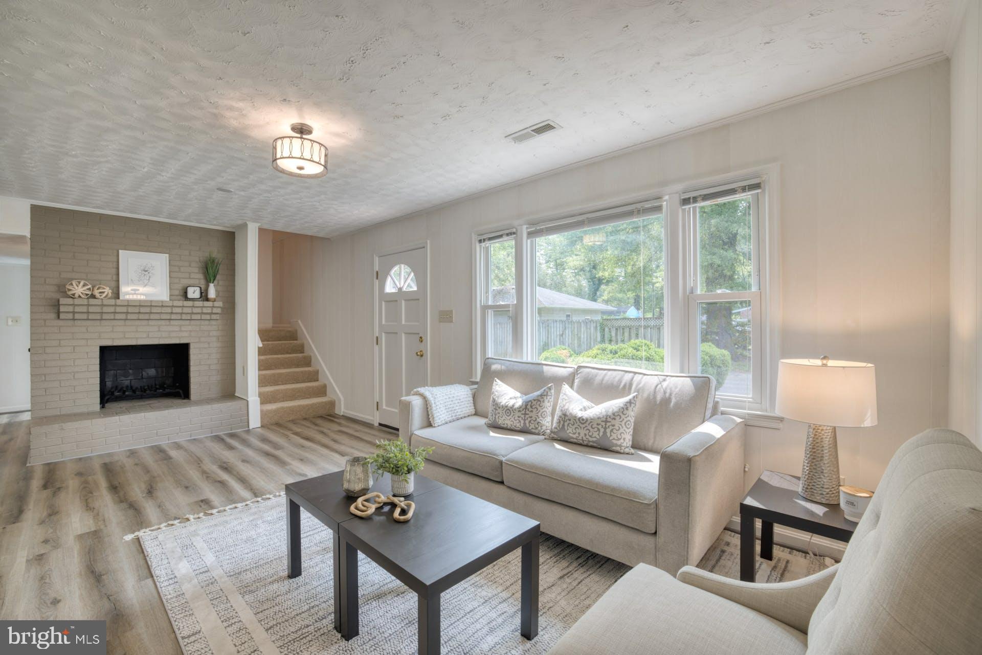 7725 Fordson Road Alexandria, VA 22306 - Photo 9 of 46 Light filled Family Rm w/ cozy fireplace