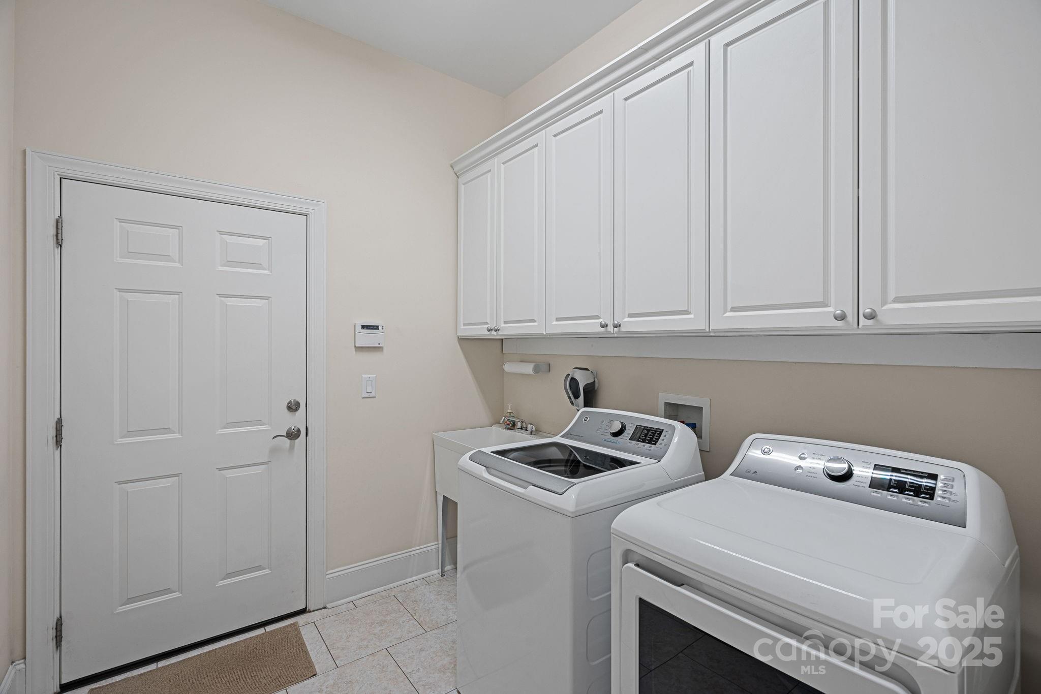9803 Tree Canopy Road Charlotte, NC 28277 - Photo 20 of 42 a view of storage and utility room with washer and dryer