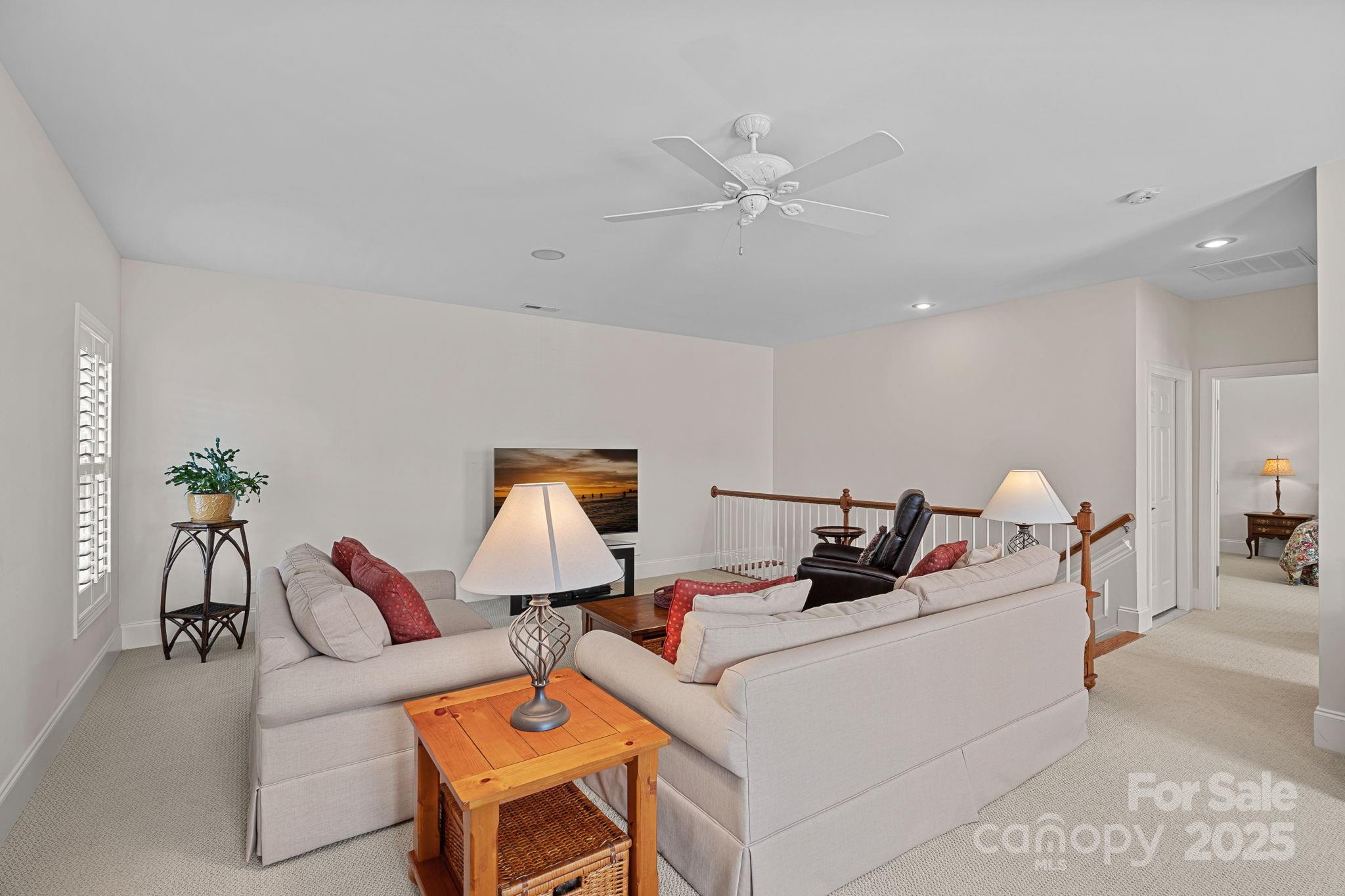 9803 Tree Canopy Road Charlotte, NC 28277 - Photo 21 of 42 a living room with furniture and a potted plant