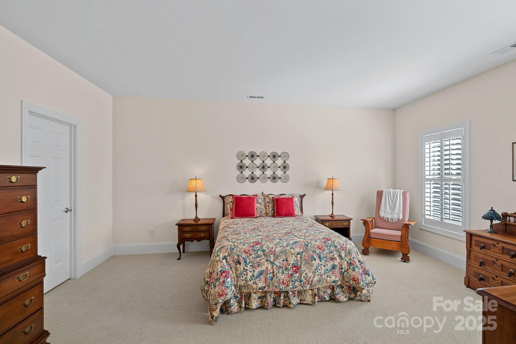 9803 Tree Canopy Road Charlotte, NC 28277 - Photo 24 of 42 a bedroom with a bed and dresser
