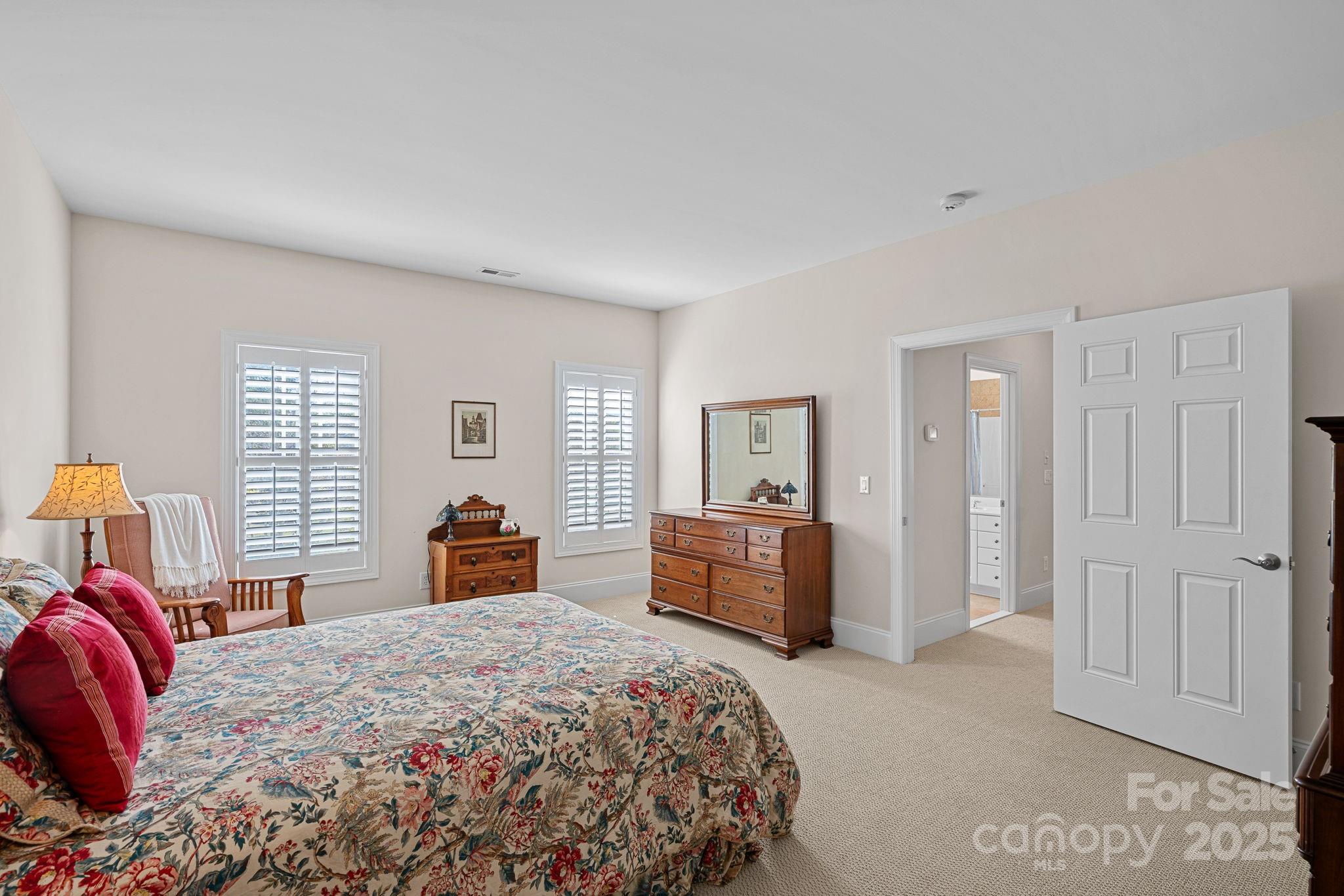 9803 Tree Canopy Road Charlotte, NC 28277 - Photo 25 of 42 a bedroom with a large bed and dresser