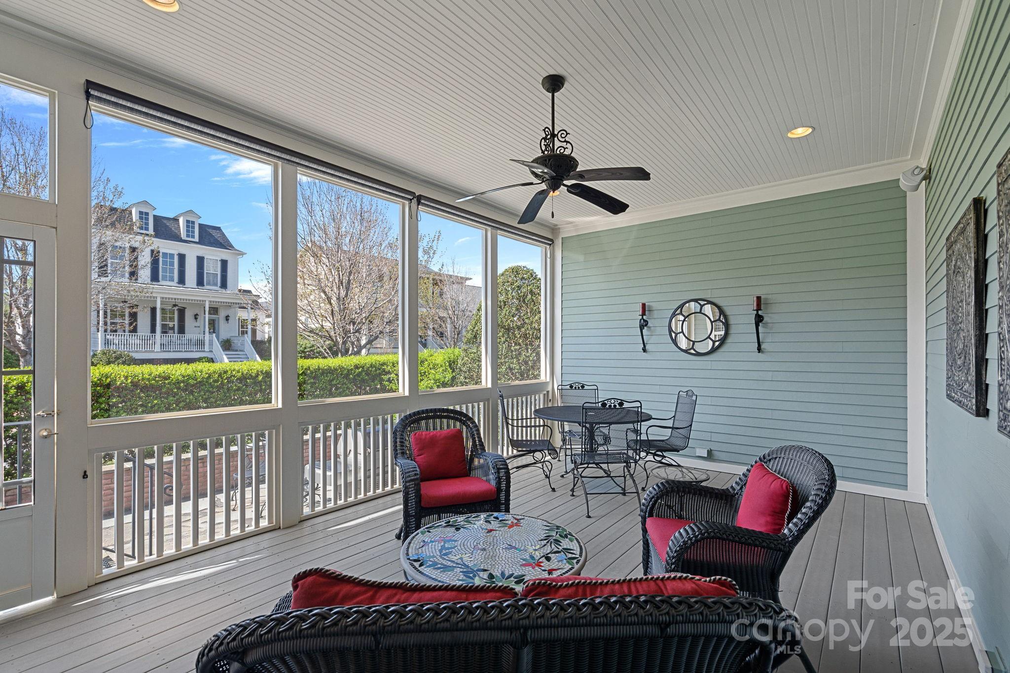 9803 Tree Canopy Road Charlotte, NC 28277 - Photo 27 of 42 a living room with furniture and a floor to ceiling window