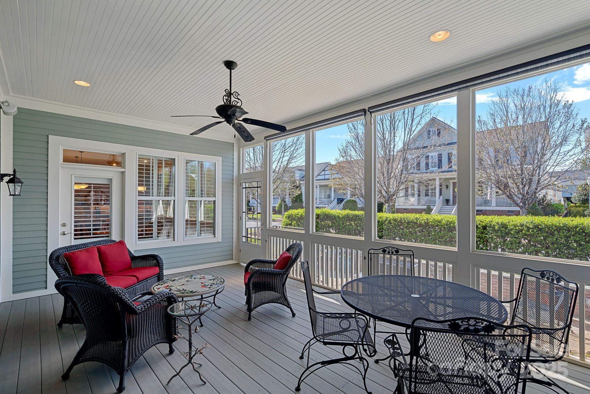 9803 Tree Canopy Road Charlotte, NC 28277 - Photo 28 of 42 a living room with furniture and a floor to ceiling window