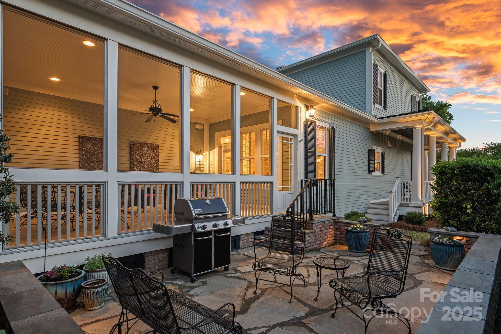 9803 Tree Canopy Road Charlotte, NC 28277 - Photo 30 of 42 a view of a patio with a table and chairs