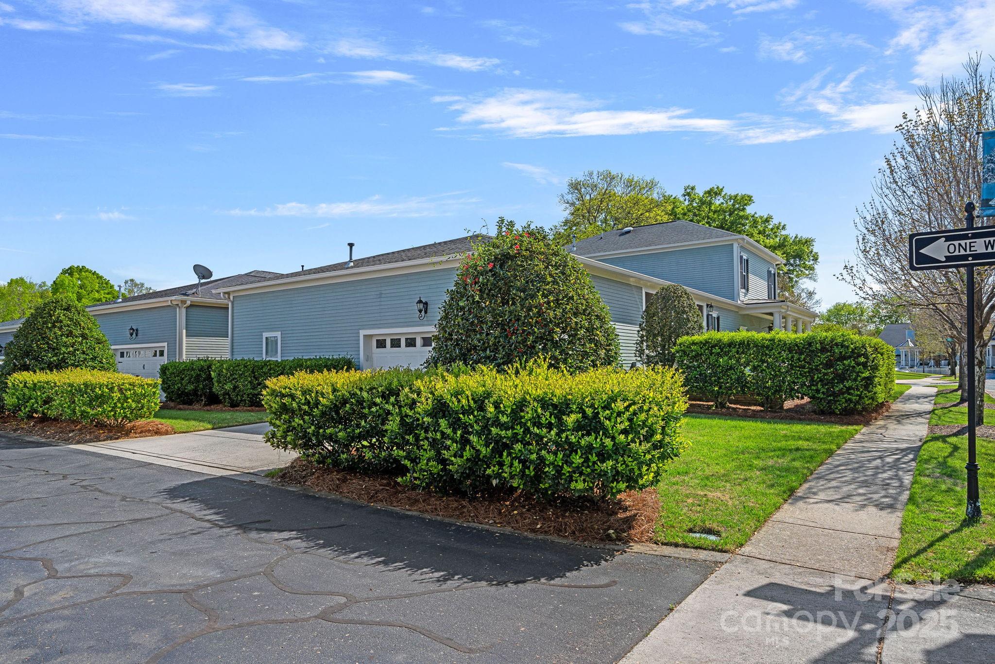 9803 Tree Canopy Road Charlotte, NC 28277 - Photo 31 of 42 a front view of a house with garden