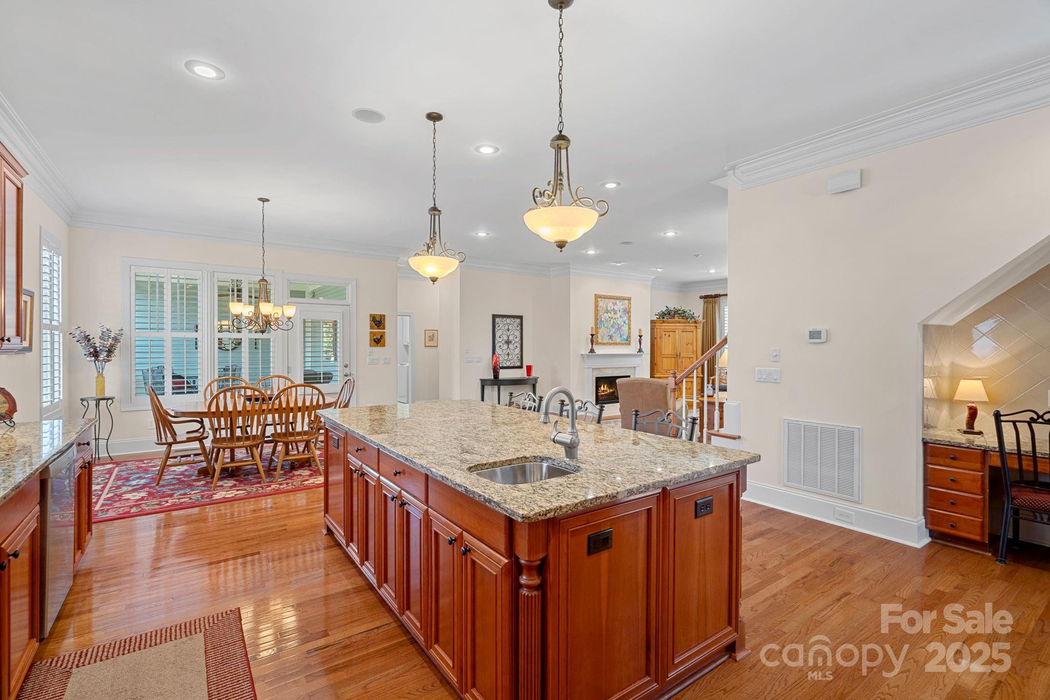 9803 Tree Canopy Road Charlotte, NC 28277 - Photo 7 of 42 a dining table with a chandelier