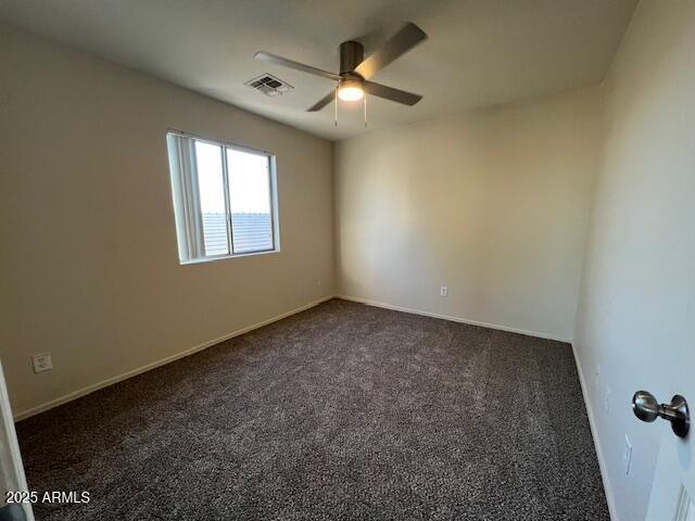19289 North Leland Road Maricopa, AZ 85138 - Photo 11 of 11 an empty room with a ceiling fan and window