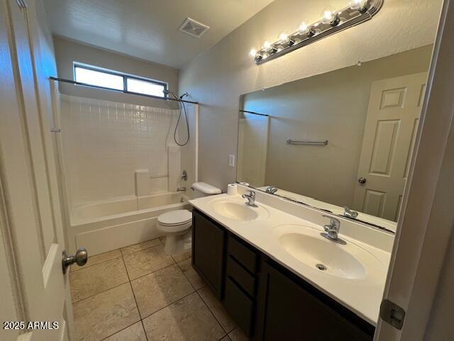 19289 North Leland Road Maricopa, AZ 85138 - Photo 5 of 11 a bathroom with a double vanity sink toilet mirror and shower