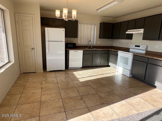 19289 North Leland Road Maricopa, AZ 85138 - Photo 8 of 11 a kitchen with a stove a refrigerator and a sink