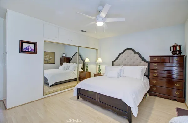 a bedroom with a bed and dresser