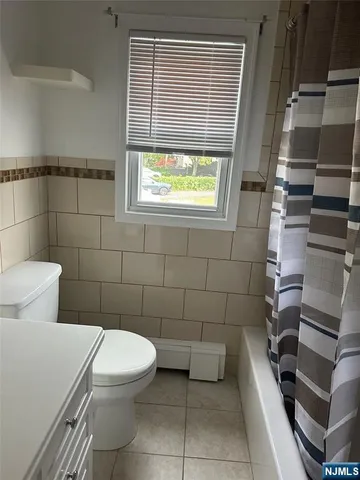 a bathroom with a toilet and a sink