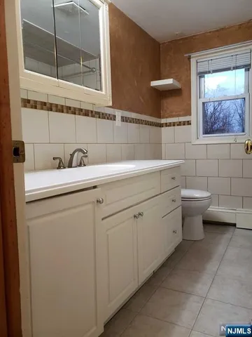 a view of bathroom with a sink and a toilet