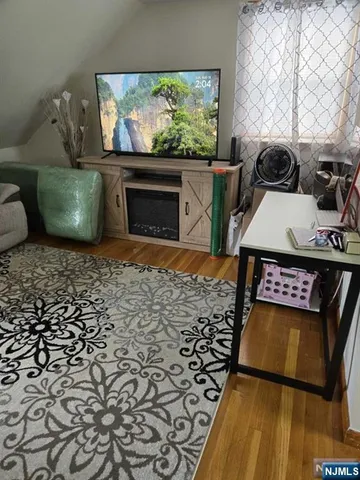 a view of a livingroom with furniture and a fireplace