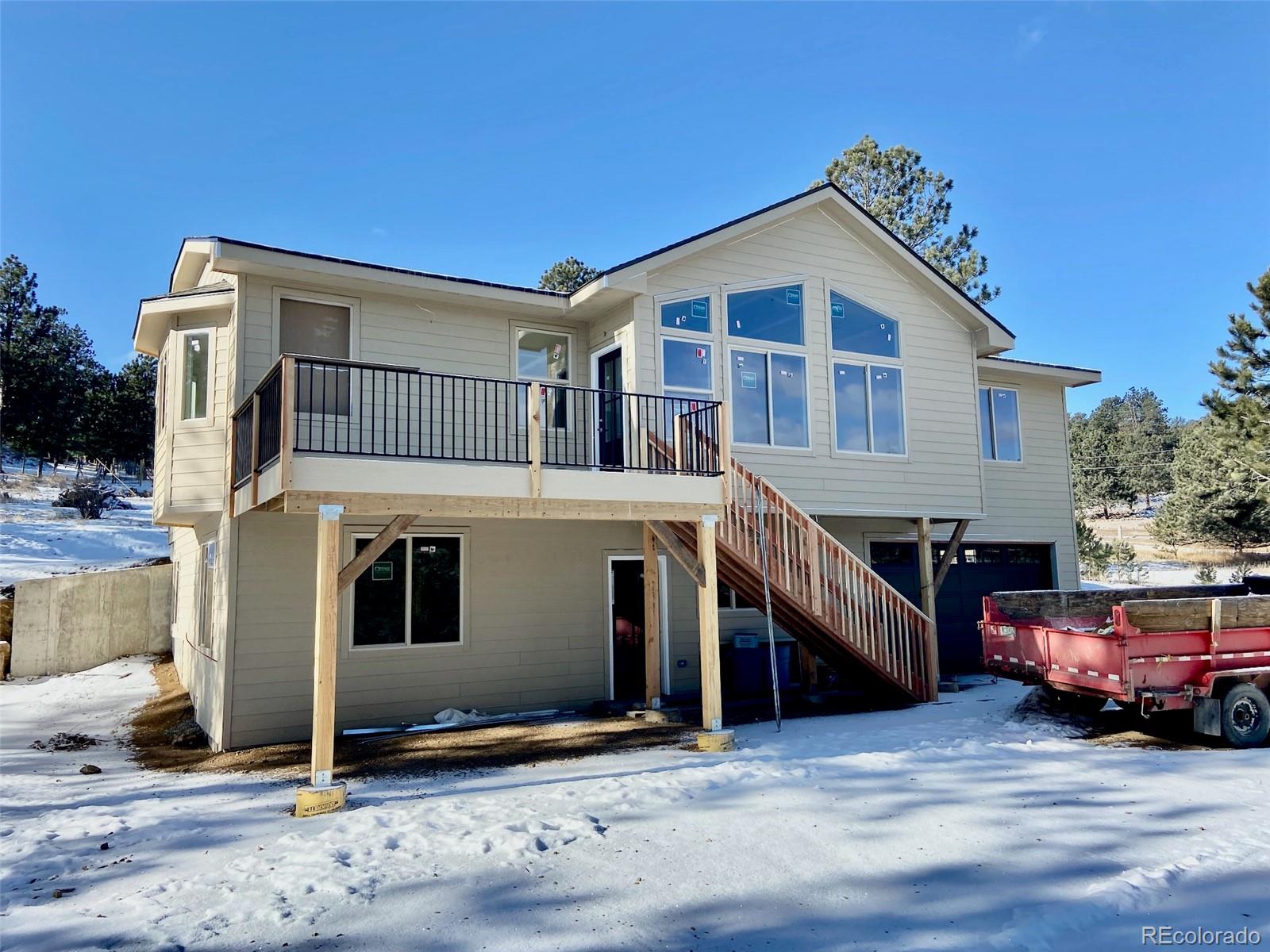 a front view of a house with parking space