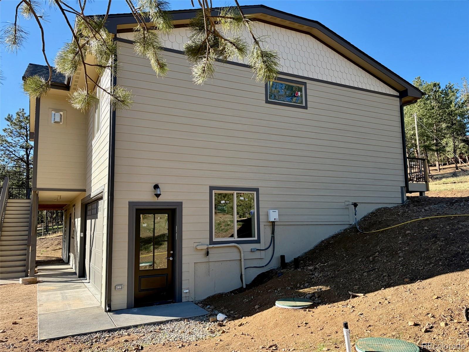 174 Chickadee Lane Bailey, CO 80421 - Photo 39 of 39 a view of a house with a yard
