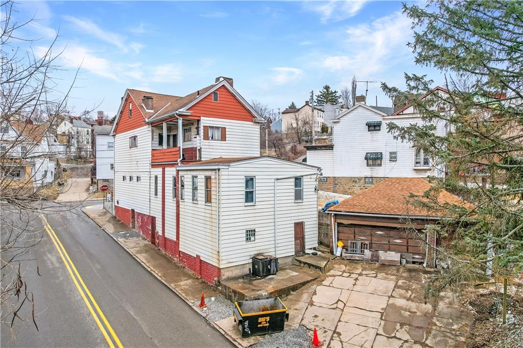 2100 Spring Street Pittsburgh, PA 15210 - Photo 14 of 14 a front view of a house with a yard