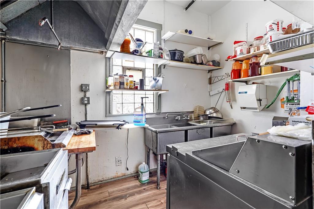 2100 Spring Street Pittsburgh, PA 15210 - Photo 9 of 14 a storage room with stainless steel appliances lots of appliances and cabinets