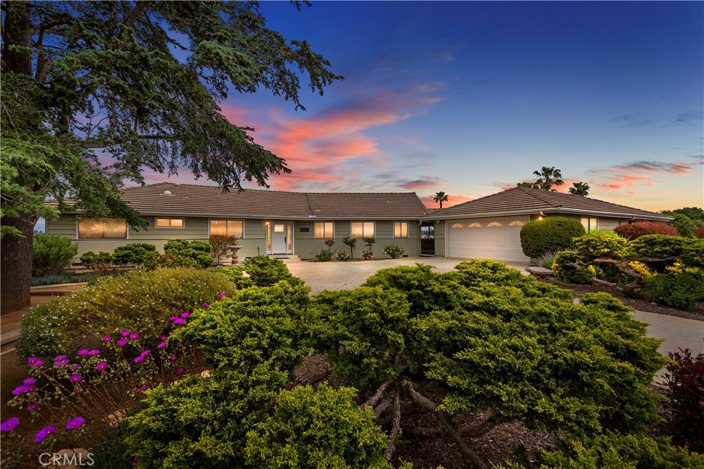 2482 Vía Del AGUACATE Fallbrook, CA 92028 - Photo 1 of 1 a front view of a house with a yard and fountain in middle