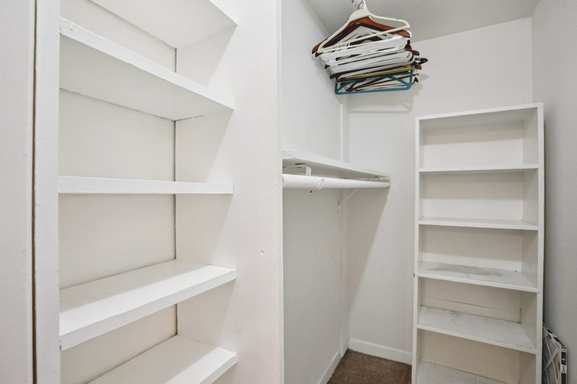 1212 Guadalupe Street, Unit 210 Austin, TX 78701 - Photo 12 of 12 Spacious closet with dark colored carpet