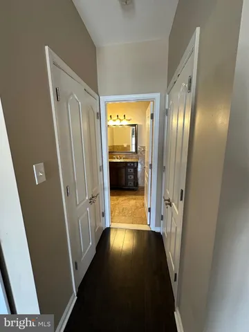 a view of gallery with wooden floor