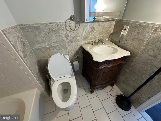a bathroom with a shower and a sink