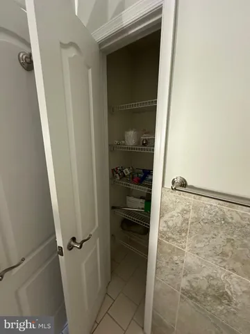a kitchen with granite countertop a refrigerator and a stove