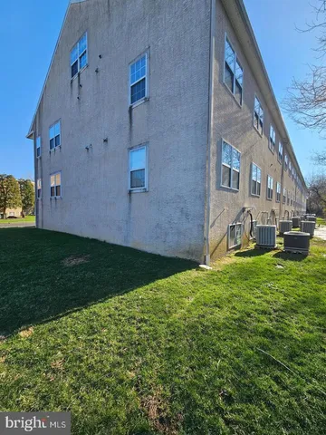 a view of house with backyard