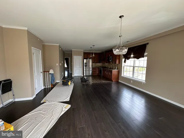 a view of a living room and hardwood floor