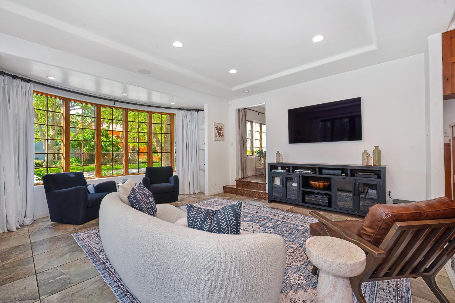 3501 Cutter Way Sacramento, CA 95818 - Photo 27 of 89 a living room with furniture and a flat screen tv