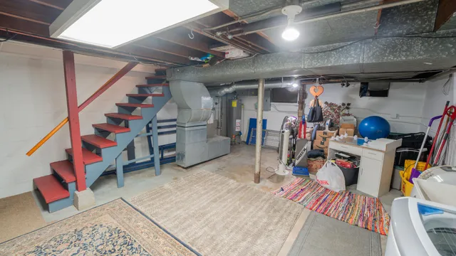 a view of wooden house with a small yard and wooden floor and fence