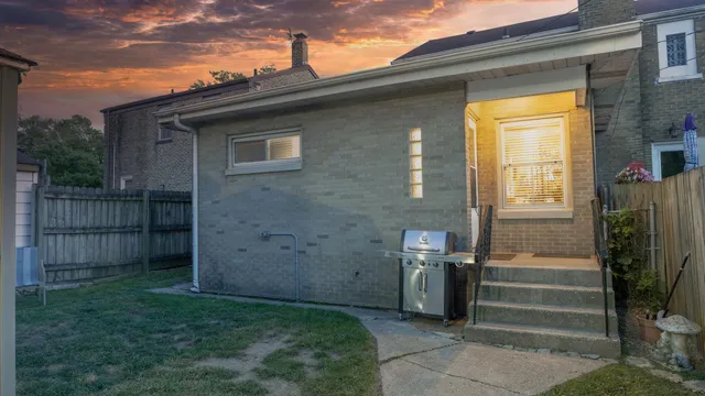 a view of house with backyard