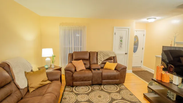a living room with furniture and a flat screen tv