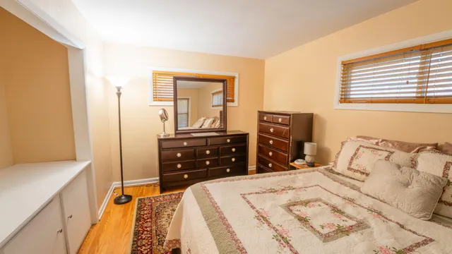 a bedroom with a bed and a dresser