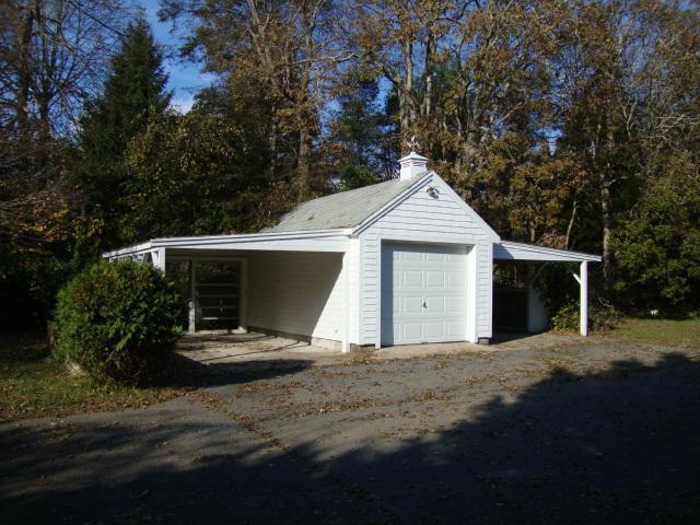128 Old Stage Road Centerville, MA 02632 - Photo 12 of 17 a front view of a house with a yard