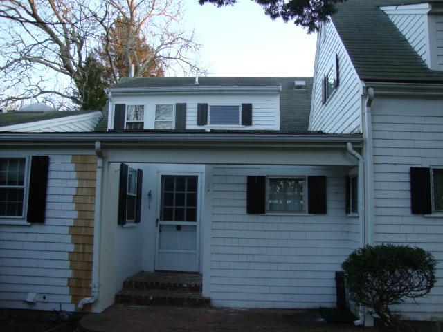 128 Old Stage Road Centerville, MA 02632 - Photo 15 of 17 a view of a house with a yard