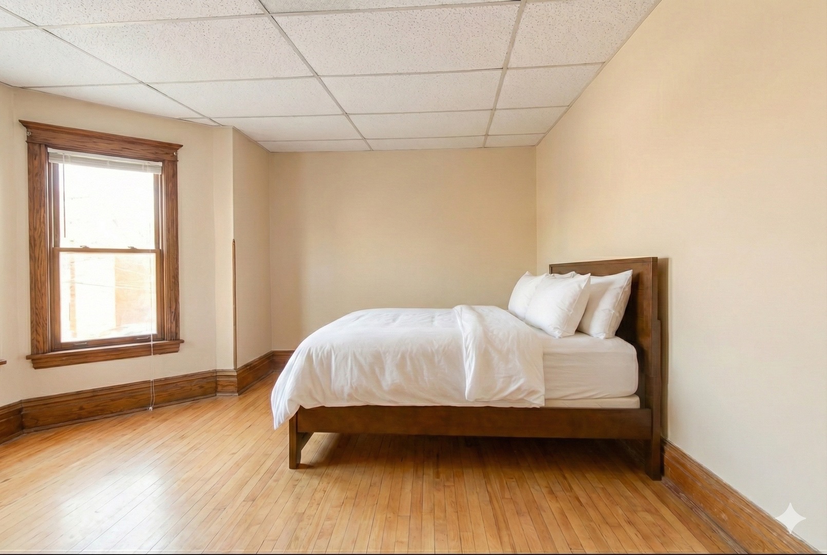 4049 South Indiana Avenue Chicago, IL 60653 - Photo 13 of 23 a bedroom with a bed and wooden floor