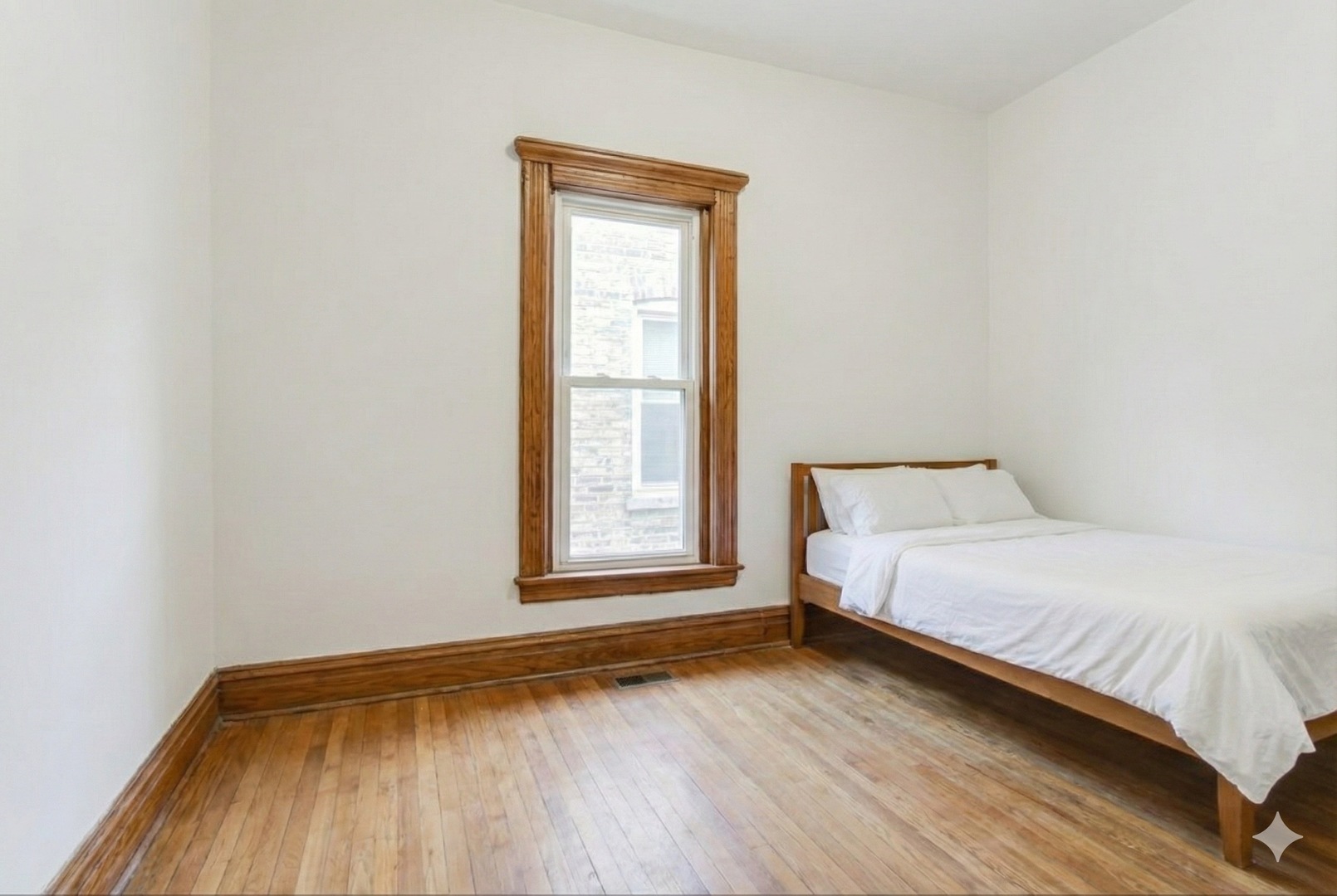 4049 South Indiana Avenue Chicago, IL 60653 - Photo 14 of 23 a bedroom with a bed and a window