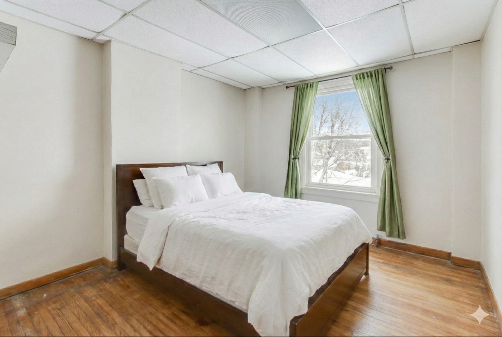 4049 South Indiana Avenue Chicago, IL 60653 - Photo 15 of 23 a bedroom with a bed and a window