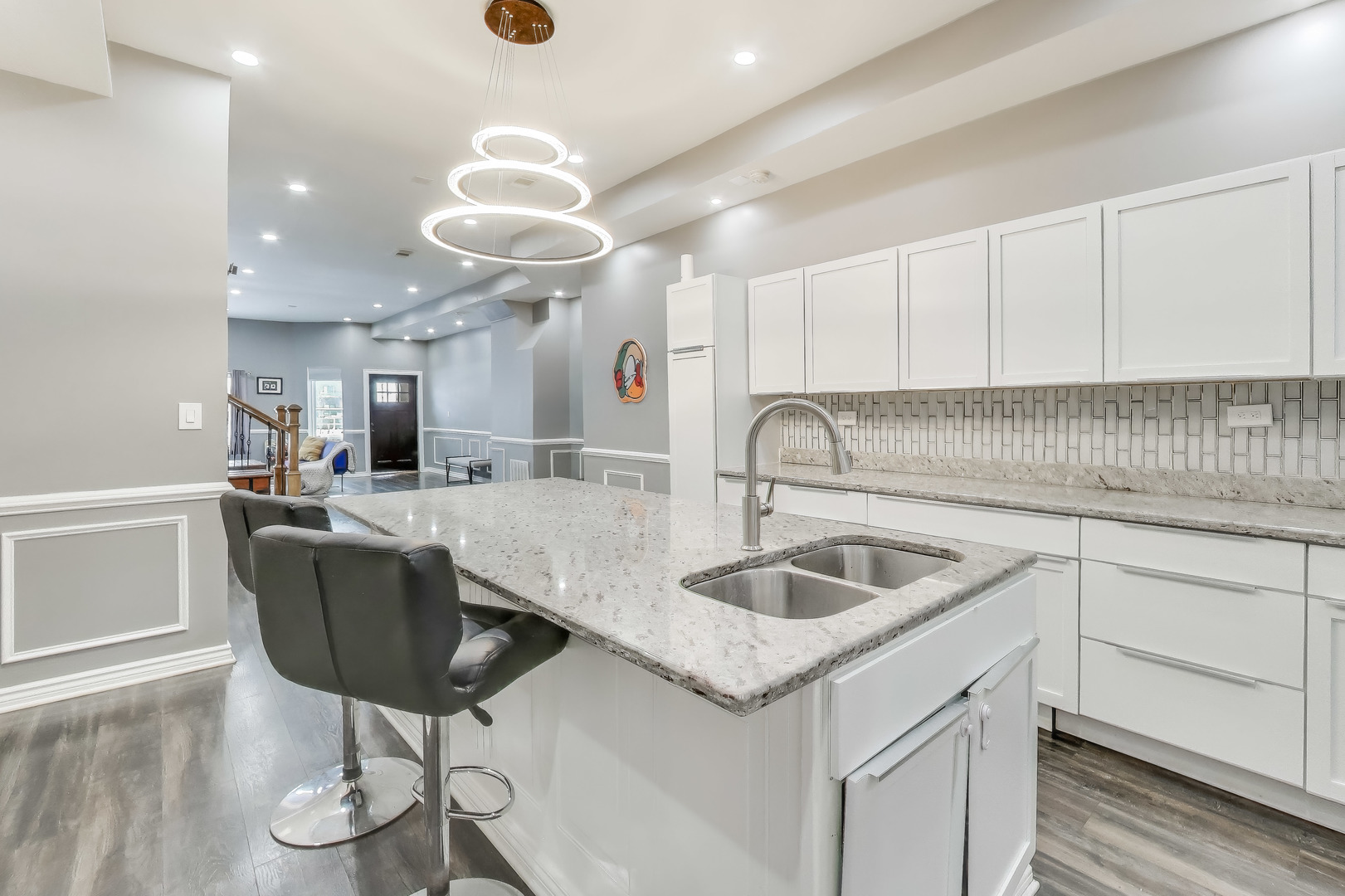 4049 South Indiana Avenue Chicago, IL 60653 - Photo 8 of 23 a kitchen with a sink cabinets and chandelier