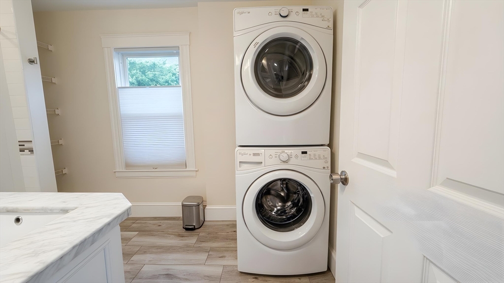 114 Curve Street Dedham, MA 02026 - Photo 11 of 27 a bathroom with a washing machine and a sink