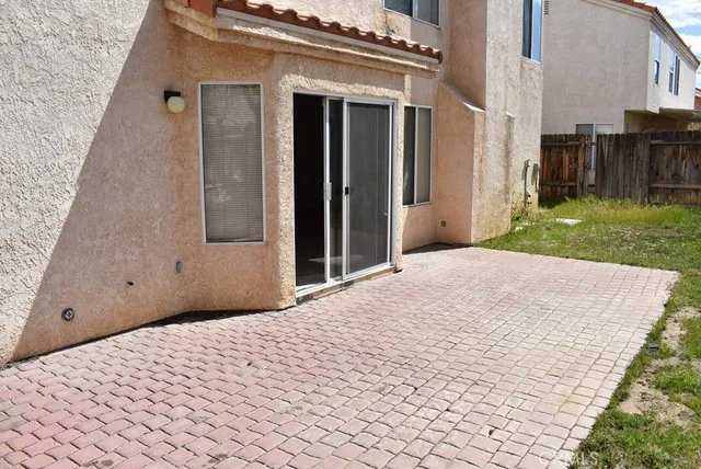 a view of a backyard of the house