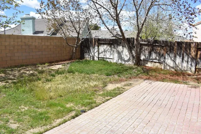 a view of a backyard of the house