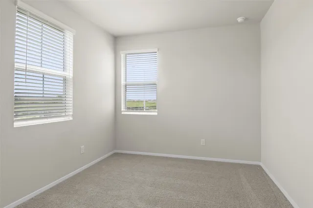 a view of a swimming pool with outdoor seating